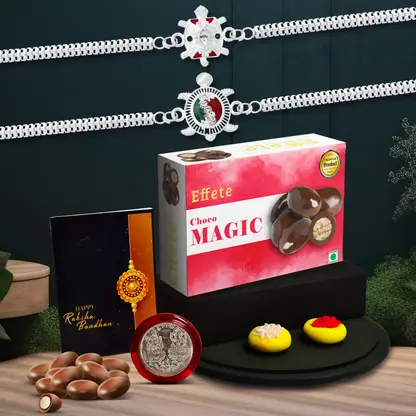 Rakhi Gift Combo With 2 Designer Rakhis For Brother Includes Choco Magic Box Silver Coin Roli Chawal Greeting Card