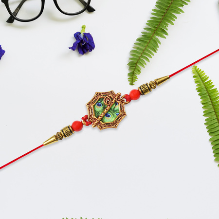 Silver Plated Floral Rakhi With Red Green Stones