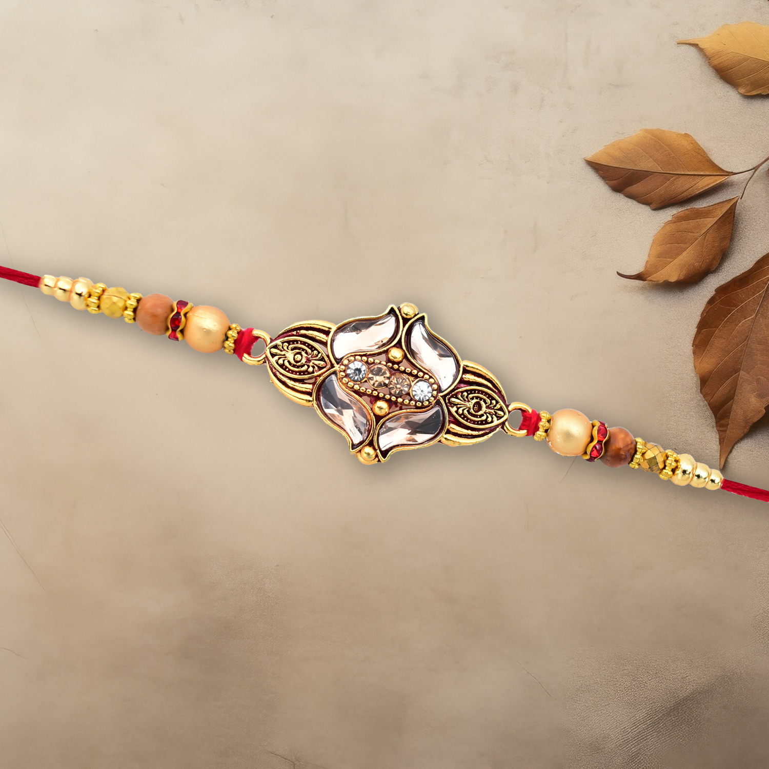 Elegant Floral Designer Rakhi With Gold-toned Beads Red Thread