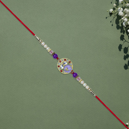 Elegant Ganesh Rakhi With Pearl And Purple Beads